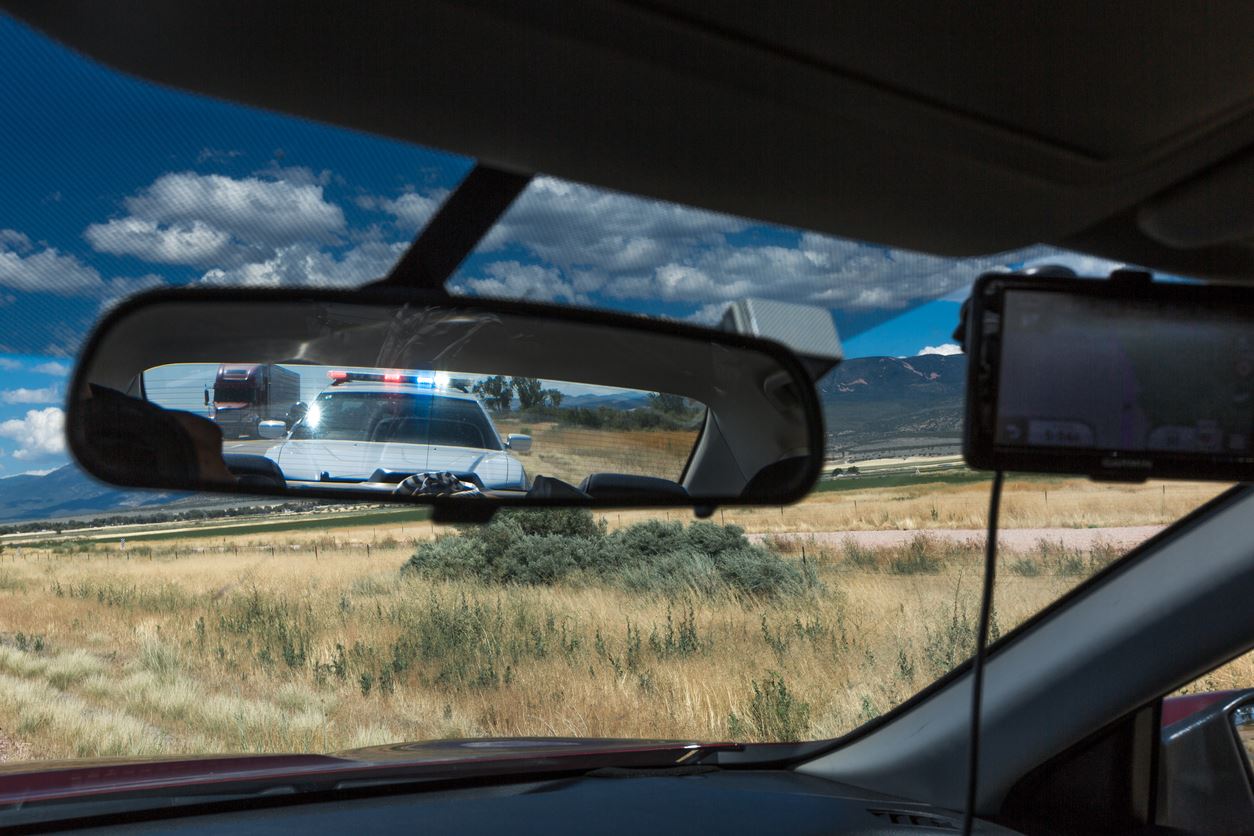 Police pulling over vehicle on the streets