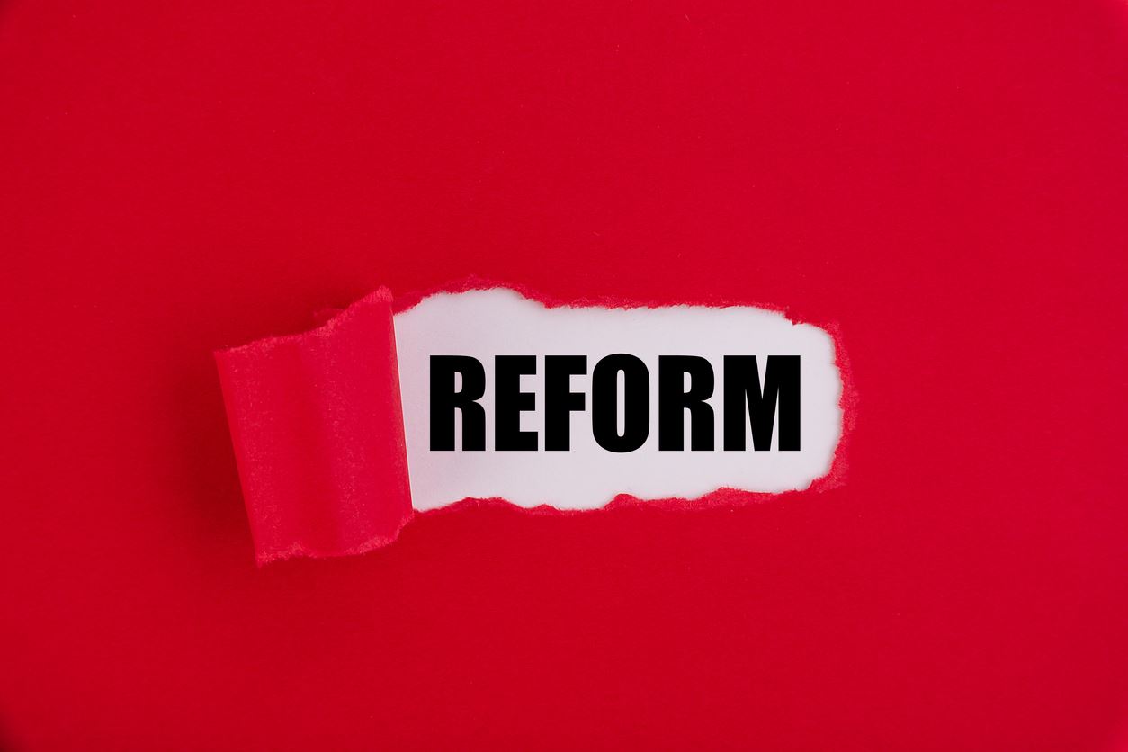 Text, word Reform on a red background